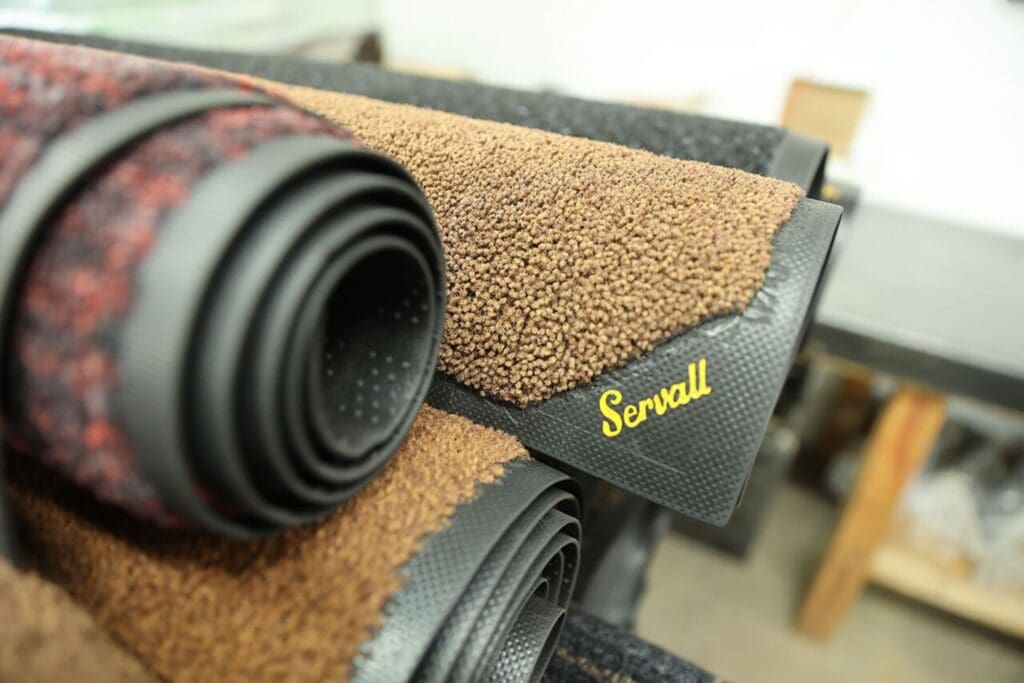 Rug with Servall logo on it